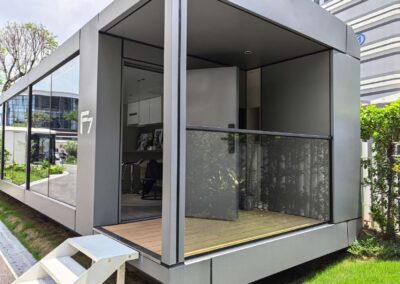 BAUSTADT F70 prefab capsule house front side angle view