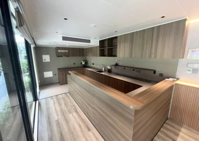 BAUSTADT WA90 space capsule house modern modular kitchen interior with wood cabinets and L shaped counter
