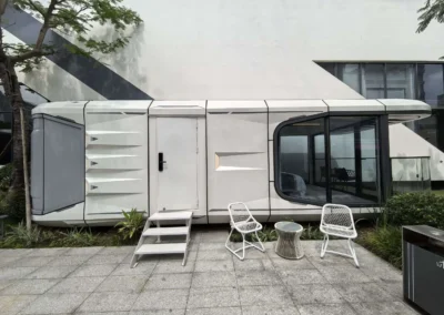 AUSTADT Space Capsule House G50 modern prefab tiny home exterior with balcony and glass front