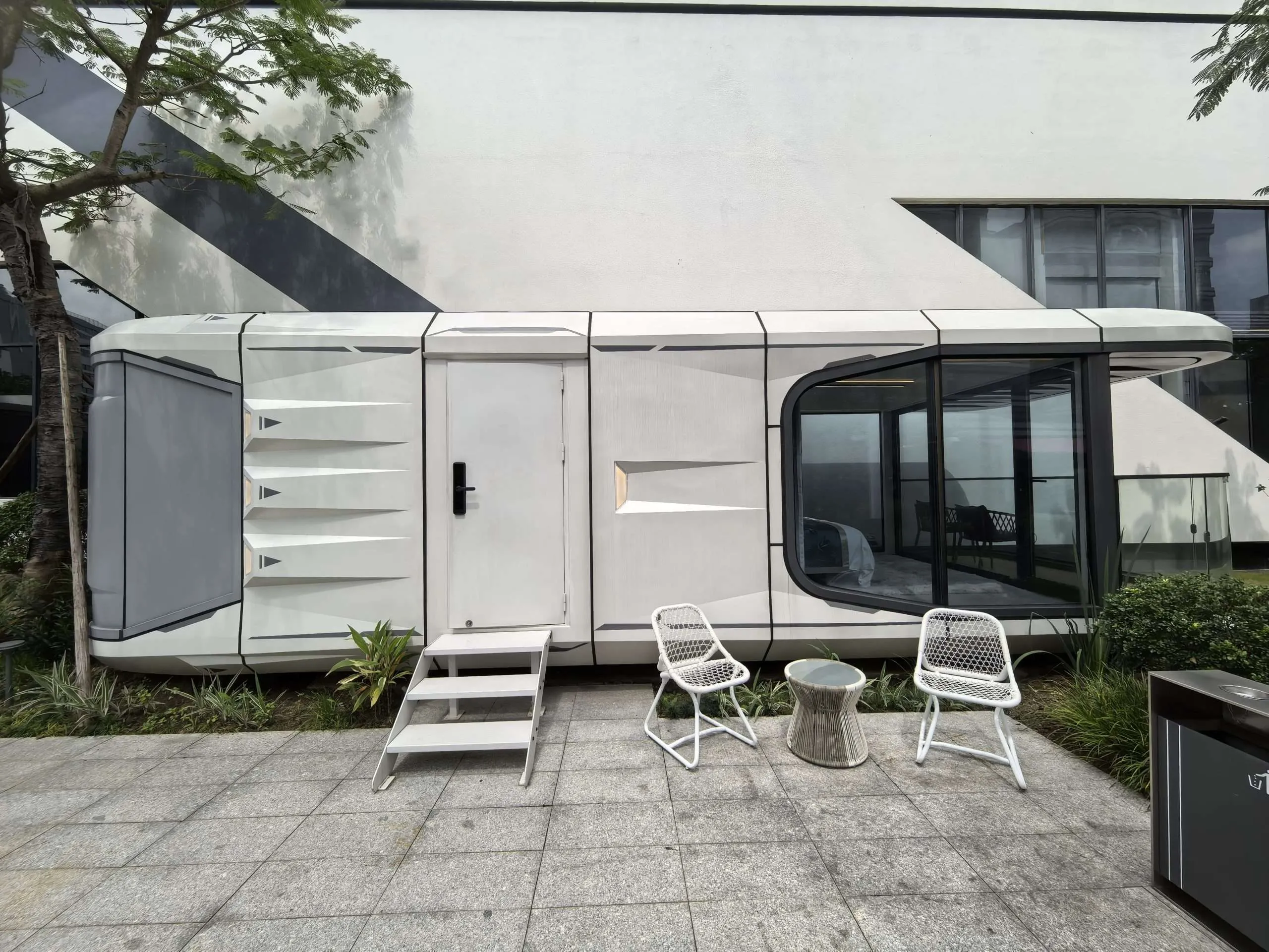 AUSTADT Space Capsule House G50 modern prefab tiny home exterior with balcony and glass front