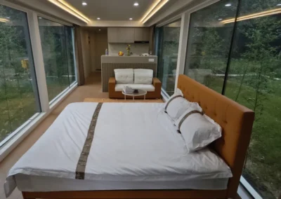 BAUSTADT Capsule House Model D8 bedroom interior with large window