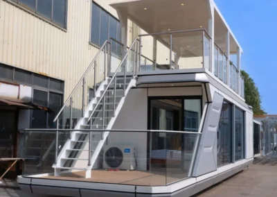 BAUSTADT Capsule House Model D8 modern prefab capsule house with rooftop terrace on beach