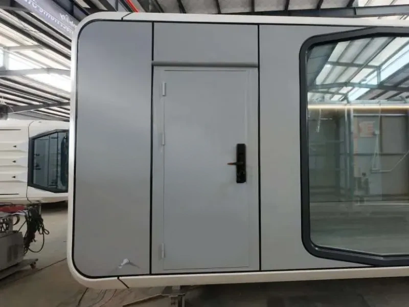 BAUSTADT Space Capsule House A50 modern modular prefab tiny home exterior front view with panoramic glass window