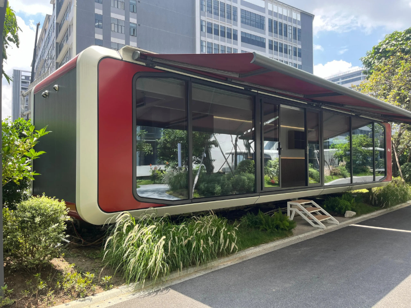 BAUSTADT Space Capsule House WA90 modern prefabricated modular home exterior with glass facade