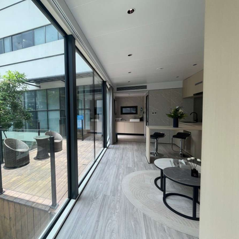 Modern modular home interior with glass walls and contemporary design layout