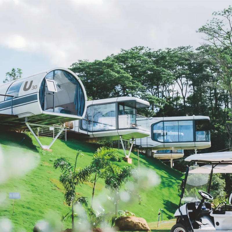 Installed modular capsule homes in landscaped outdoor environment